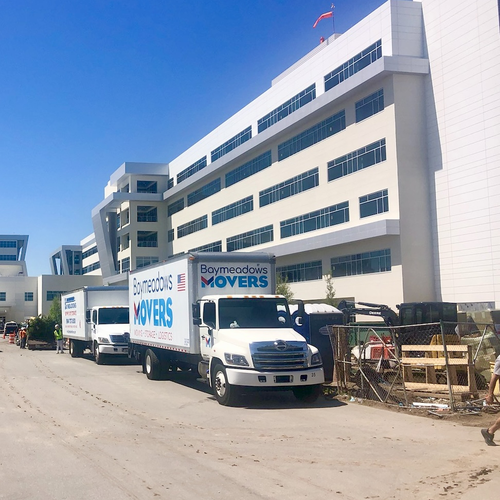 Moving truck in front of a building